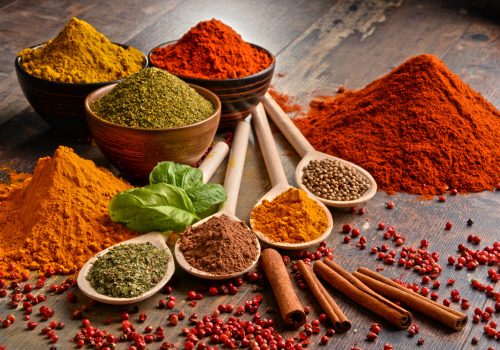 Variety of spices on kitchen table.